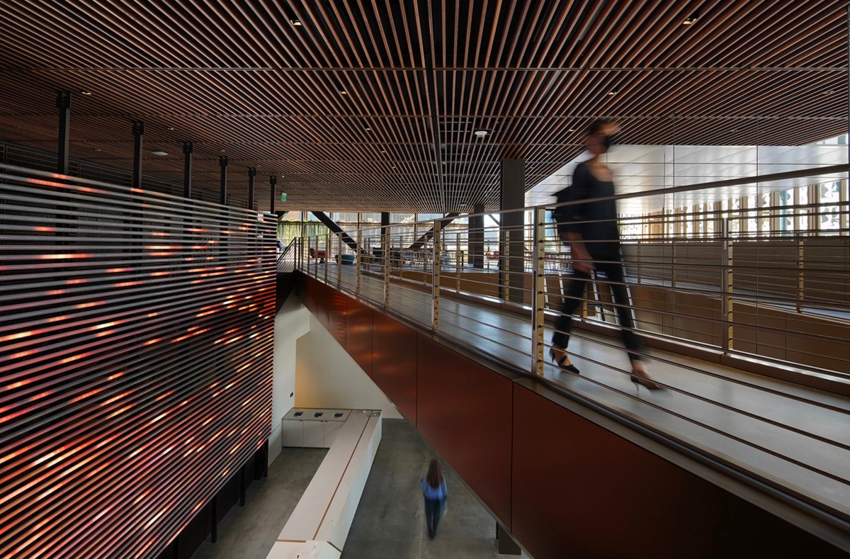 View of second floor of lobby, with a person walking across the walkway