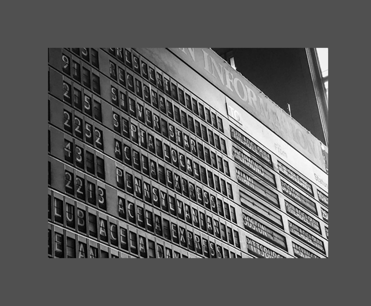 Photograph of train station clacking board