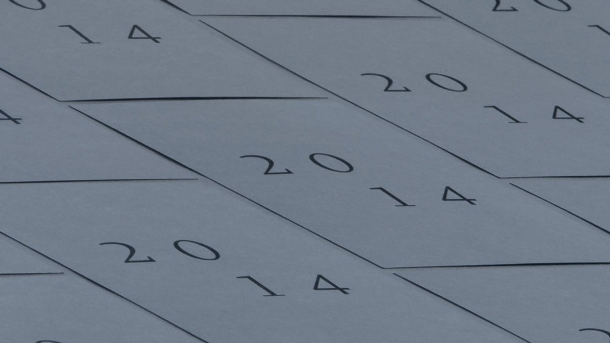 Repeated arrangement of a design that says "2014", split into two rows of "20" and "14" and misaligned