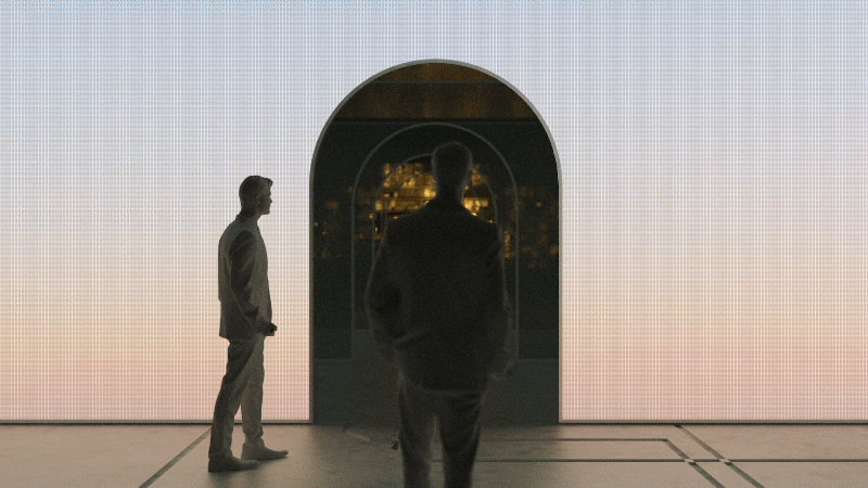 Animation of person moving through scrim archways, illuminating as he passes through. 