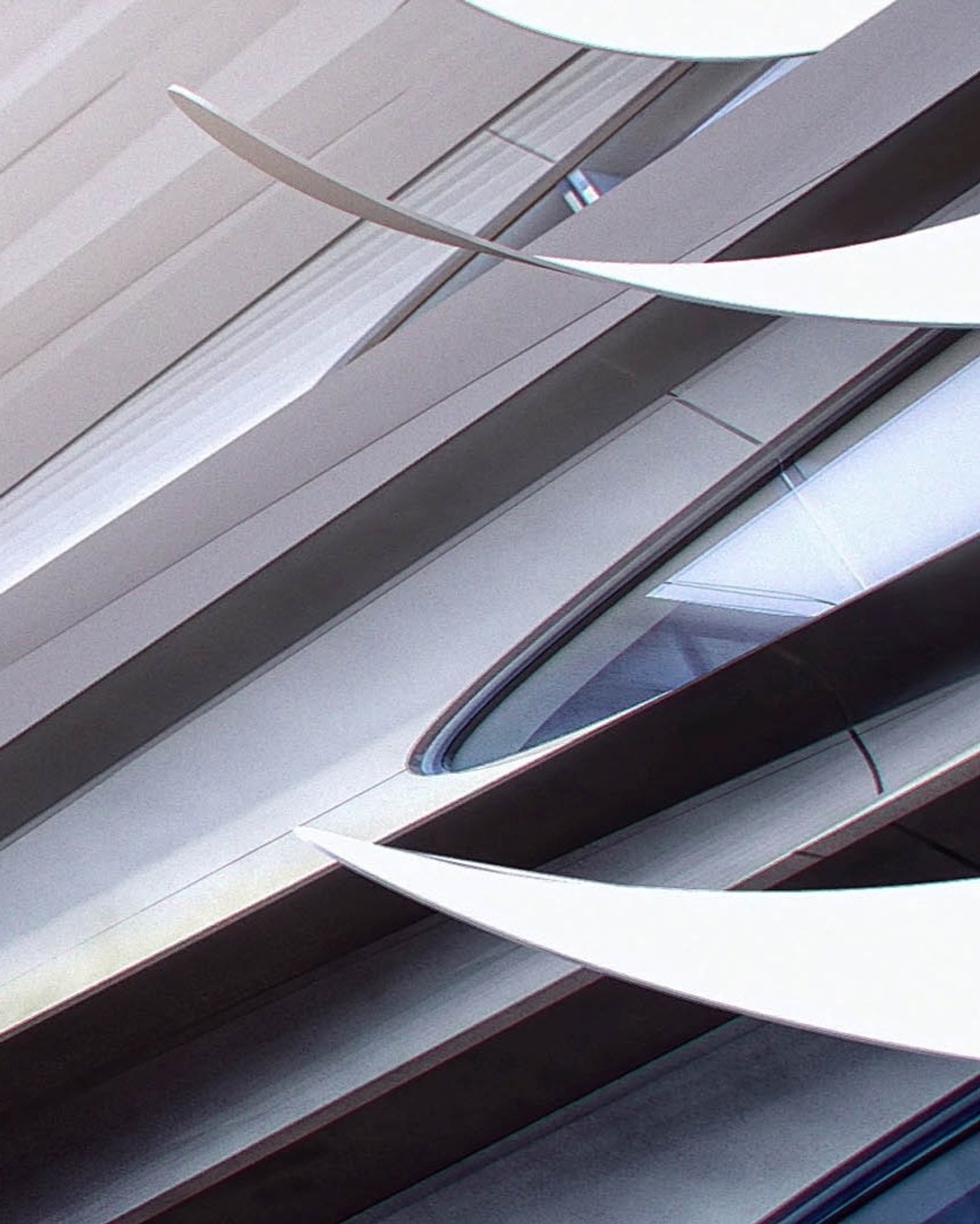 Close-up of avant garde form of exterior building, resembling sleek, aerial structures 
