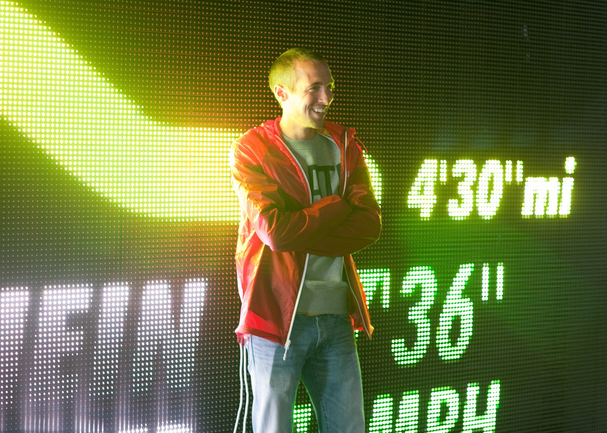 Man looking at their results displayed on the screen, showing their speed