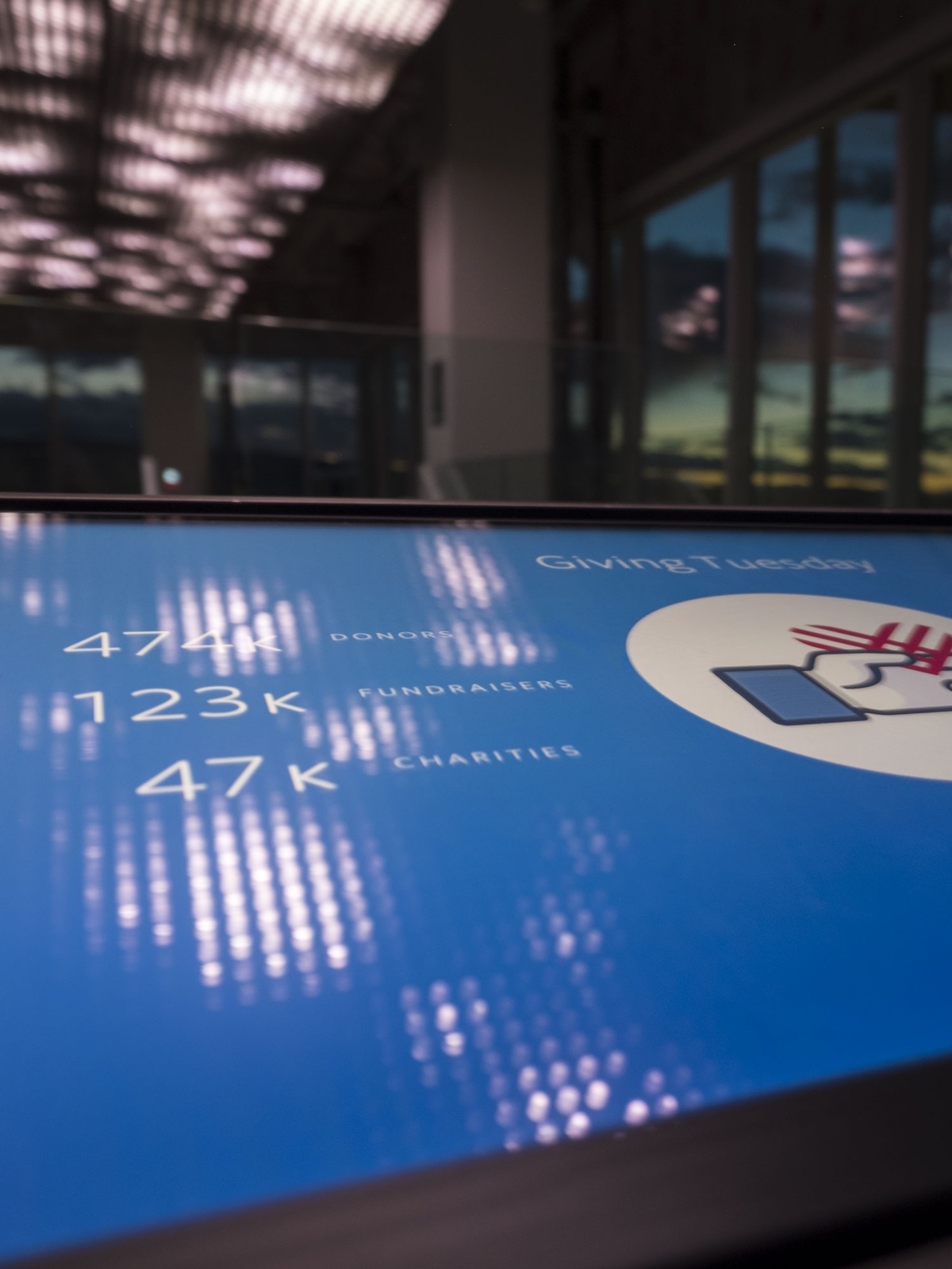 Close-up of interactive screen underneath ceiling installation that controls the data visualization