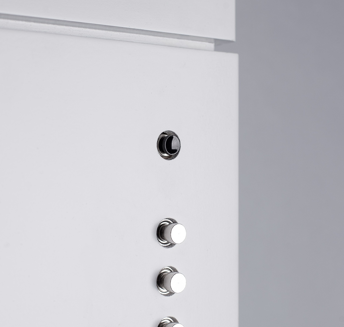 Close-up of buttons on device that control the number of rays of light in the installation