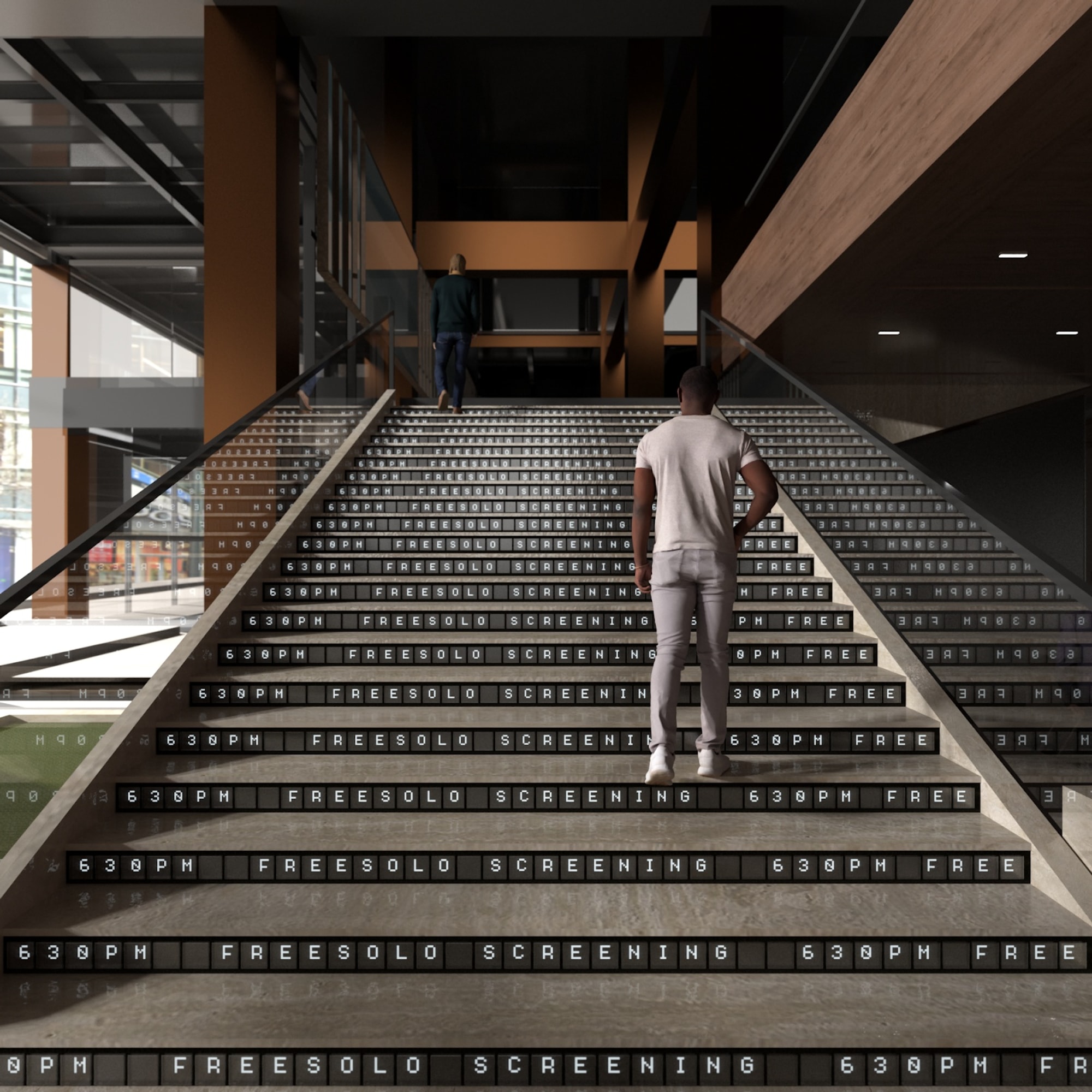Man walking up staircase with digital lettering in stair treads