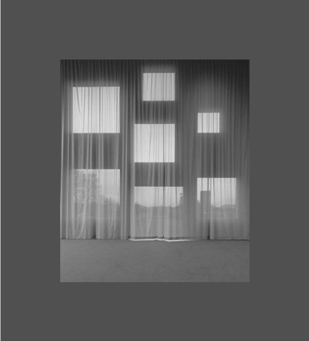 Reference image of irregularly sized and spaced square windows behind a semi-translucent curtain