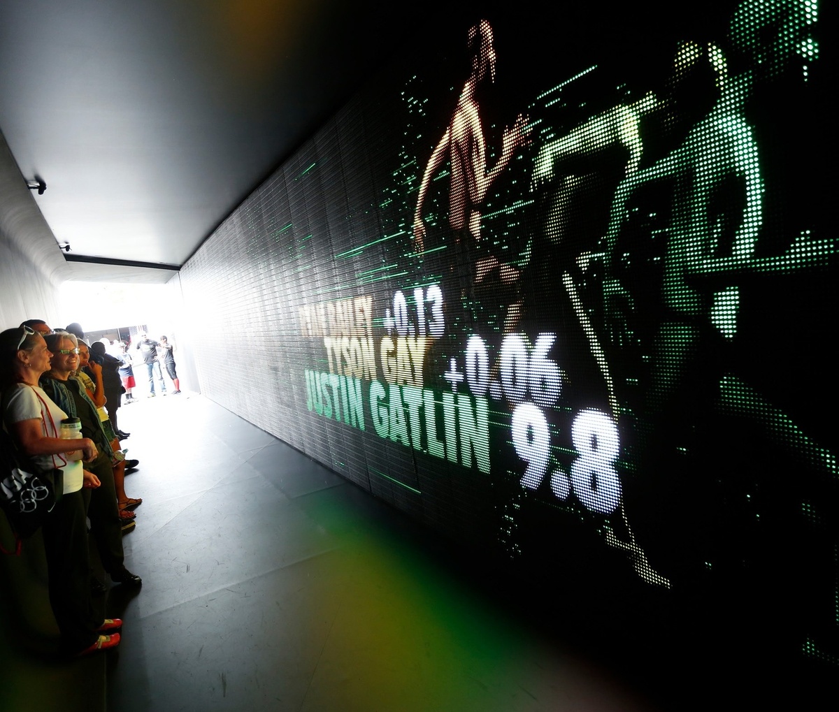 Famous and successful track athletes and their respective times displayed on a screen