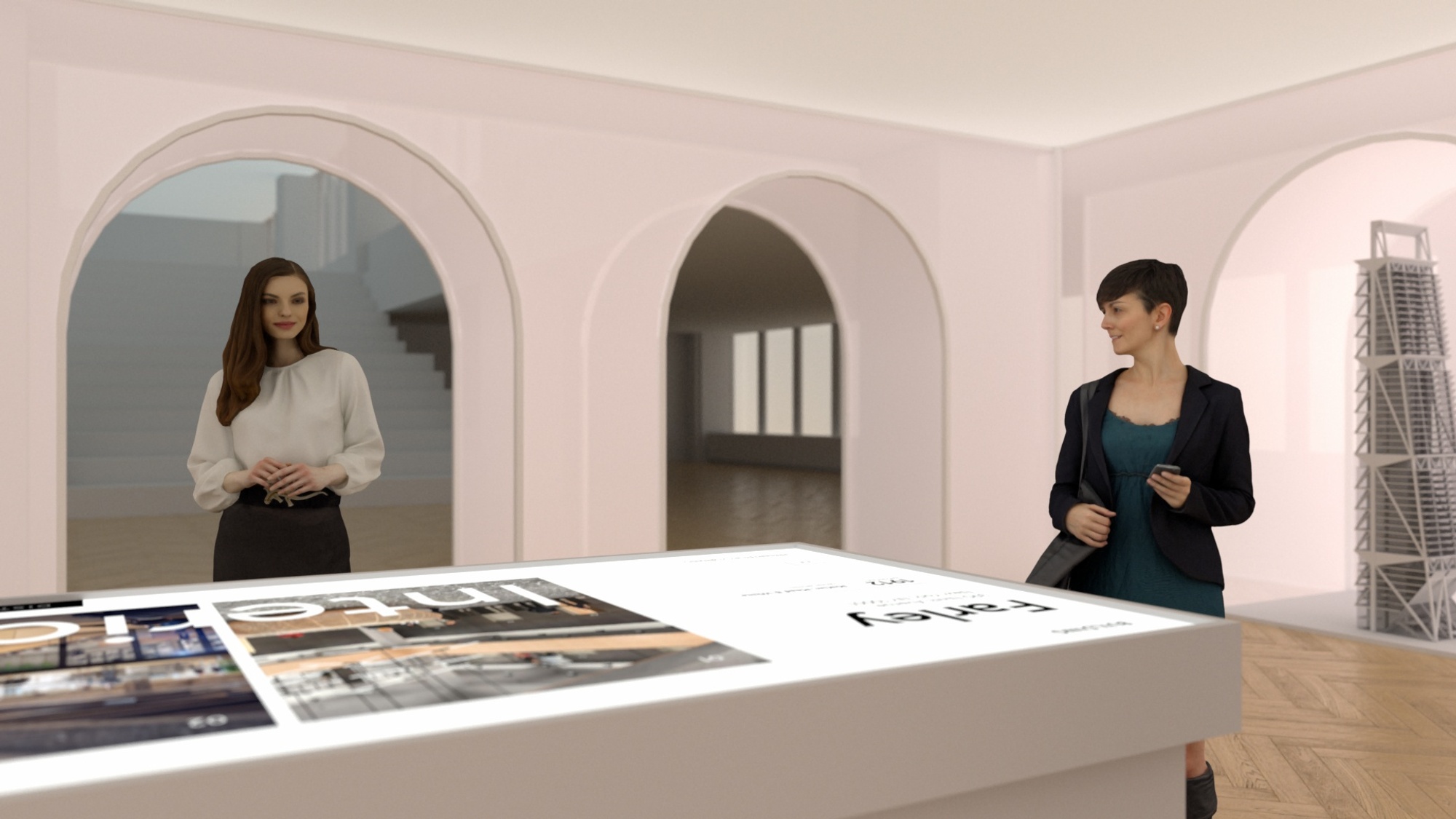 Two women standing at digital table, with architectural models in background