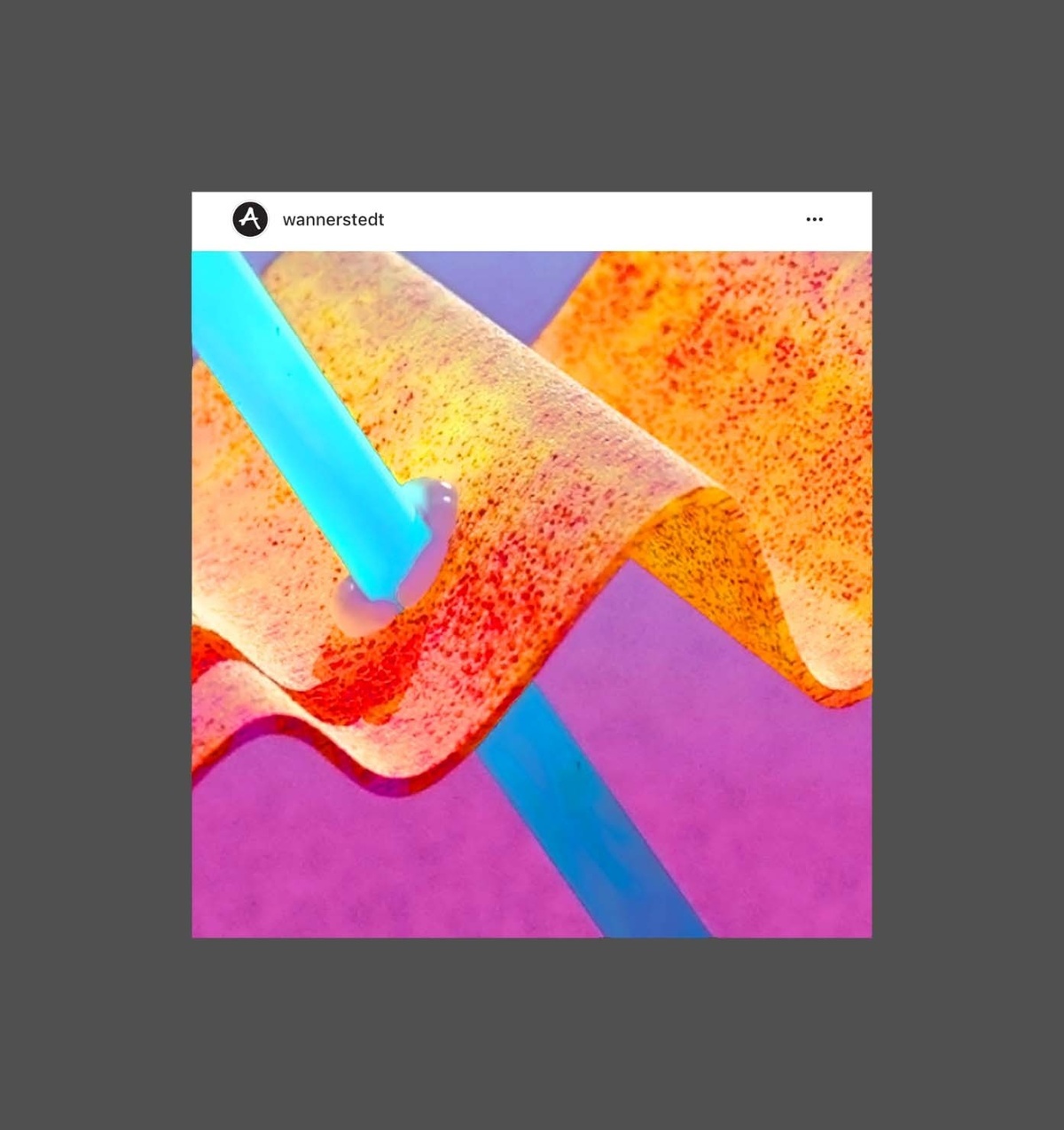 Instagram image of wavy orange glass in front of magenta background