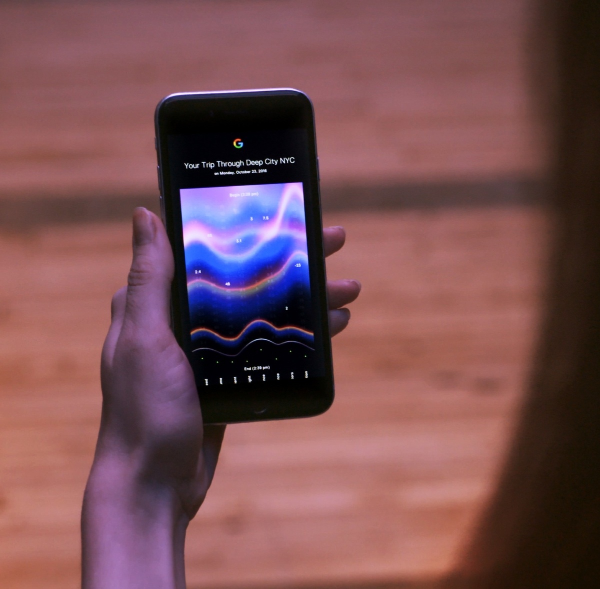 Person holding a phone in their hand, which displays their personalized data insights